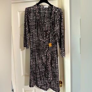 Women’s Calvin Klein, gently used, faux wrap dress. Size 16.